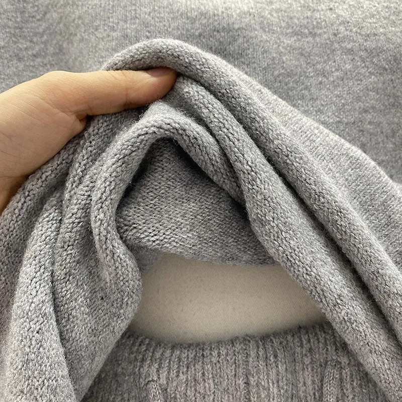 Women's knitted loose-fitting sweater and wide-leg shorts two-piece set in a neutral colour.