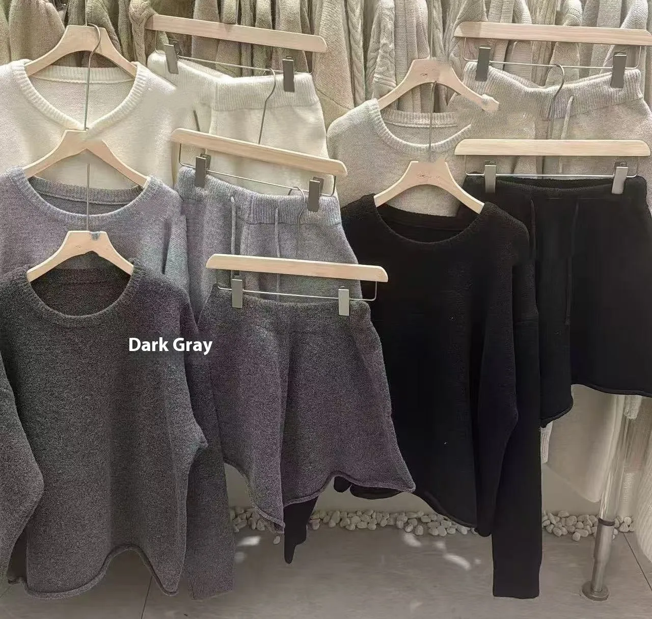 Women's knitted loose-fitting sweater and wide-leg shorts two-piece set in a neutral colour.