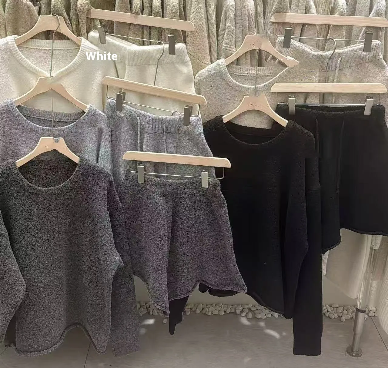 Women's knitted loose-fitting sweater and wide-leg shorts two-piece set in a neutral colour.
