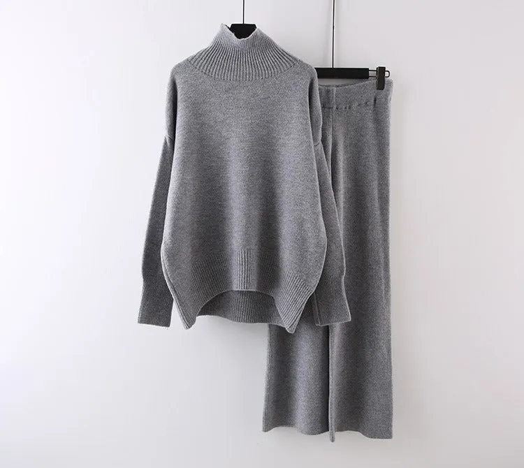 Women's milky white acrylic two-piece set with long sleeve top and wide-leg trousers on a hanger.
