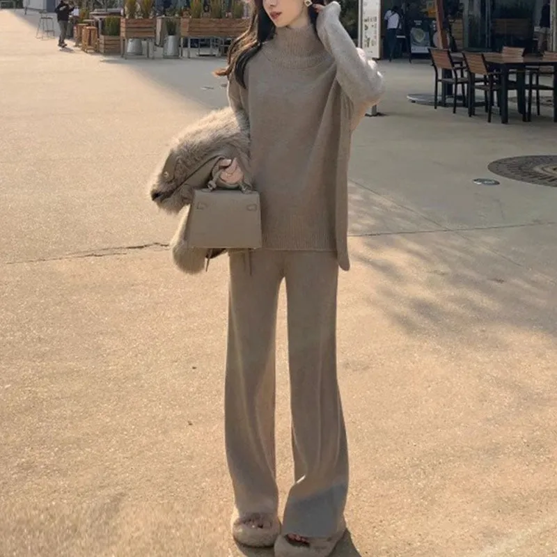 Women's milky white acrylic two-piece set with long sleeve top and wide-leg trousers on a hanger.
