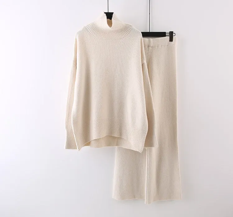 Women's milky white acrylic two-piece set with long sleeve top and wide-leg trousers on a hanger.