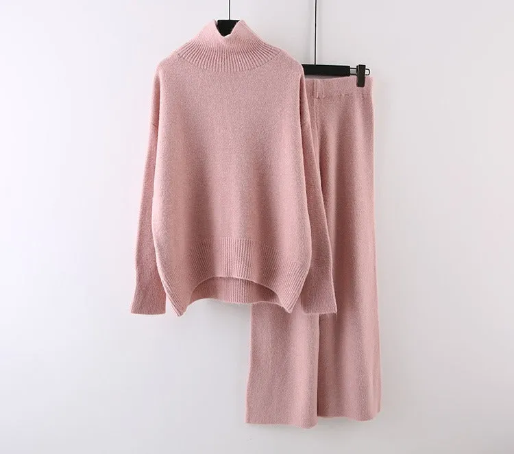 Women's milky white acrylic two-piece set with long sleeve top and wide-leg trousers on a hanger.