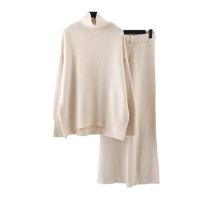 Women's milky white acrylic two-piece set with long sleeve top and wide-leg trousers on a hanger.
