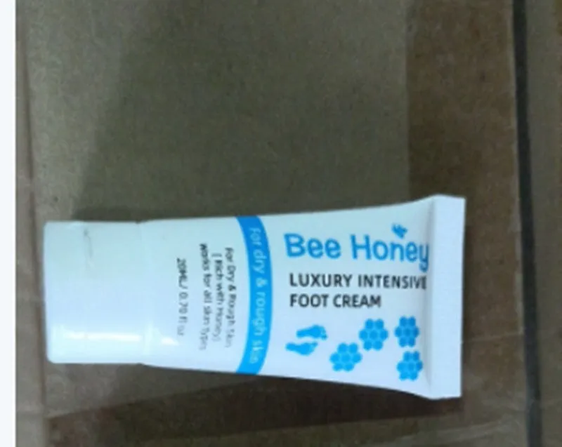 White tube of honey moisturising foot cream 20g with honey and avocado extracts