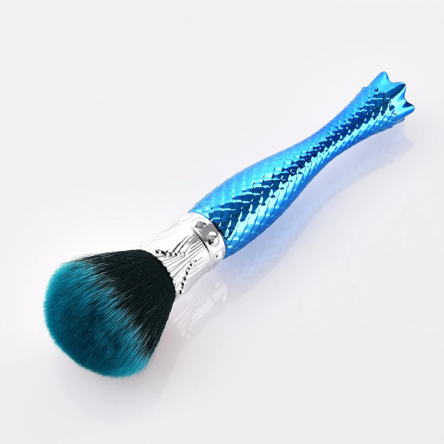 Demon blue single makeup brush with nylon bristles and plastic handle on white background