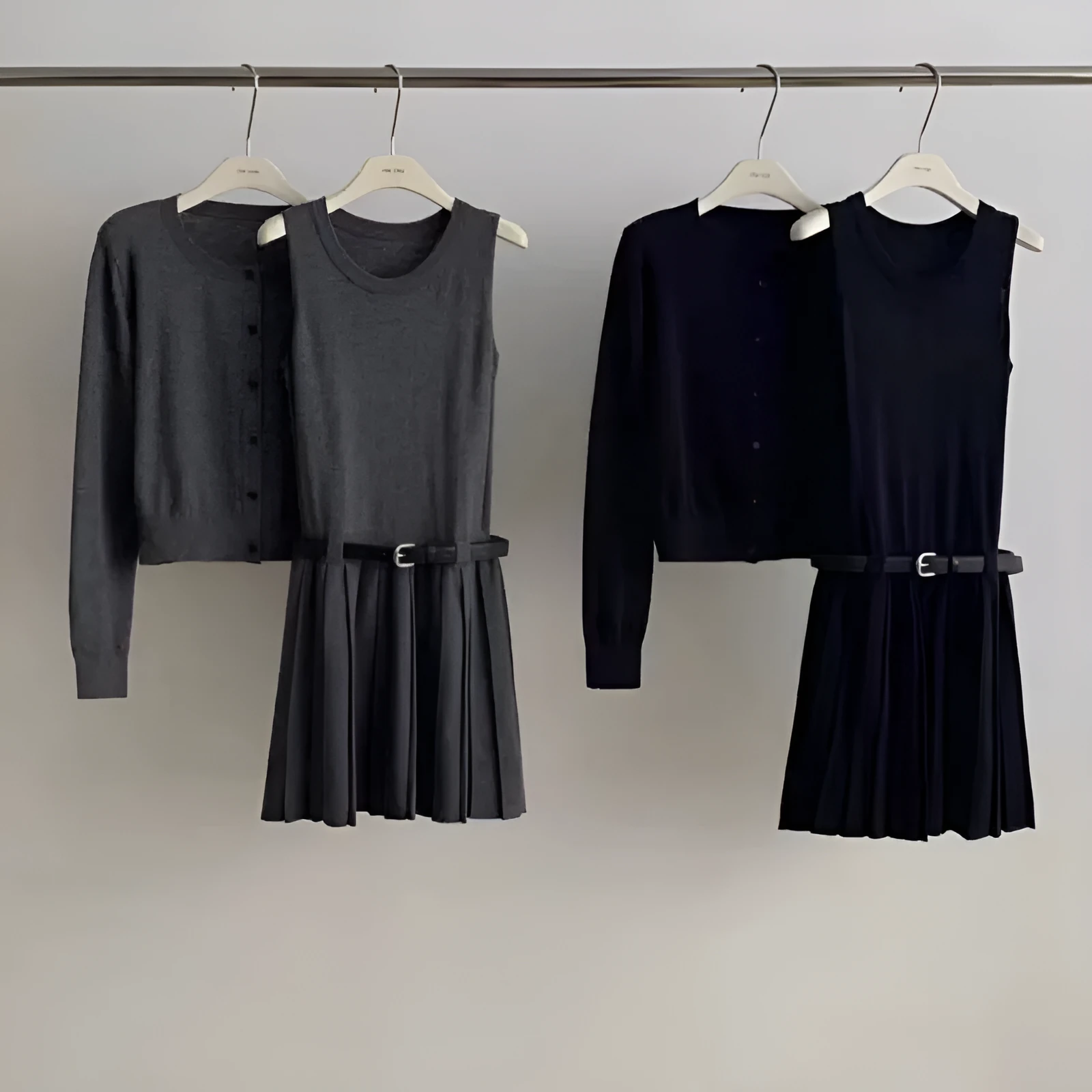 Grey Art Retro style women's knitted vest skirt and long-sleeved cardigan two-piece set with a 3D pattern.