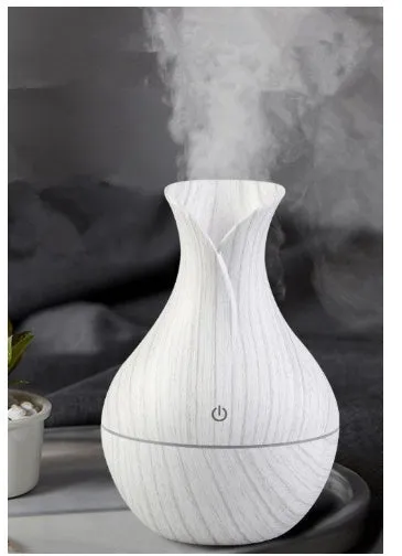Small vase humidifier with 130ml water tank in Crackle Mahogany finish, USB powered, on a wooden desk