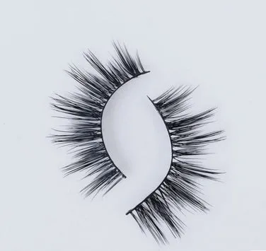 Pair of faux mink eyelashes with long tail and cotton stem against white background