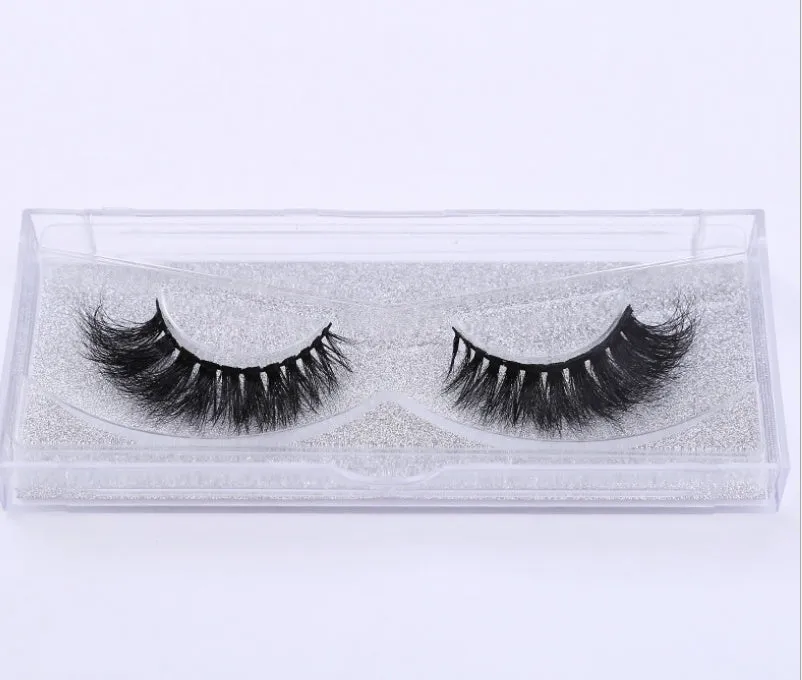 Pair of faux mink eyelashes with long tail and cotton stem against white background