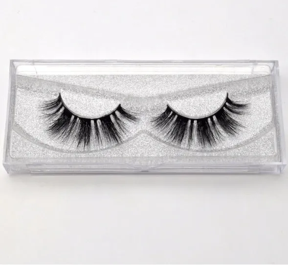 Pair of faux mink eyelashes with long tail and cotton stem against white background