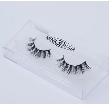 Pair of faux mink eyelashes with long tail and cotton stem against white background