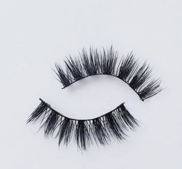 Pair of faux mink eyelashes with long tail and cotton stem against white background