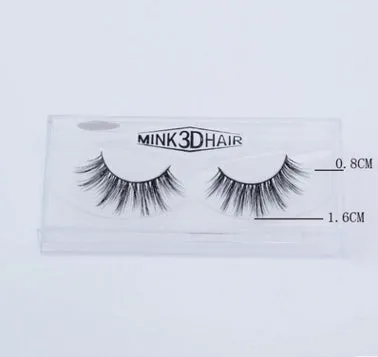 Pair of faux mink eyelashes with long tail and cotton stem against white background