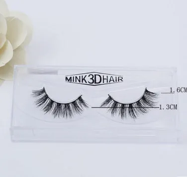 Pair of faux mink eyelashes with long tail and cotton stem against white background