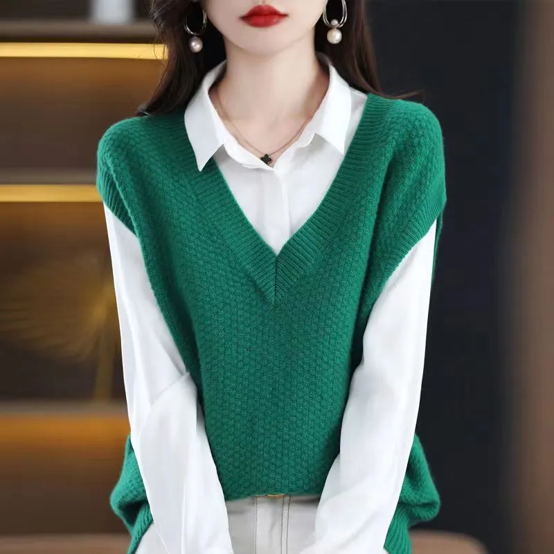Women's creamy-white V-neck sleeveless knitted vest with a 3D pattern, laid flat.