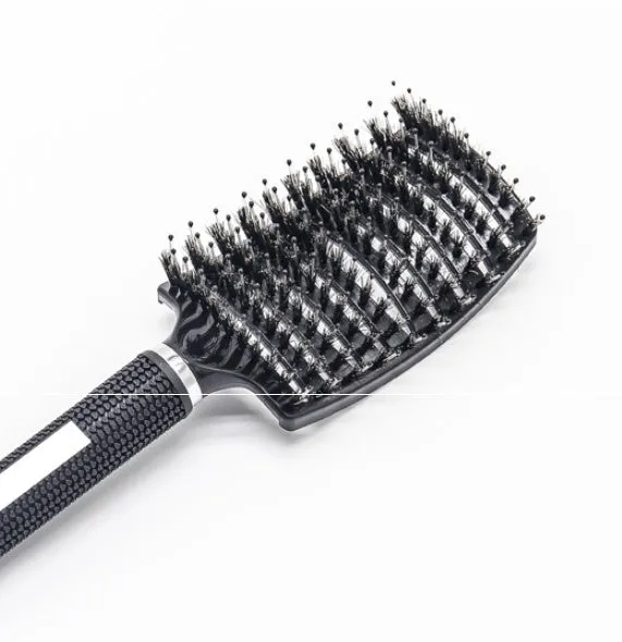 Black bristle and nylon hairbrush with arched comb head and non-slip rubber handle on white background
