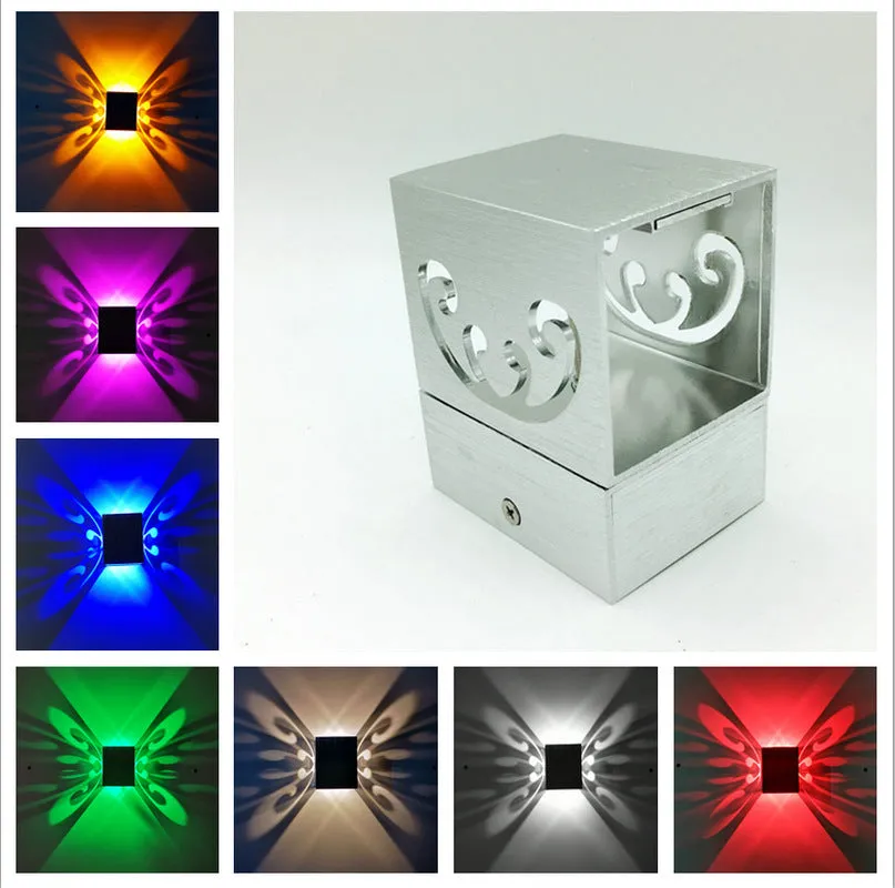 Modern aluminium butterfly-shaped LED wall lamp with remote control for seven colour options.