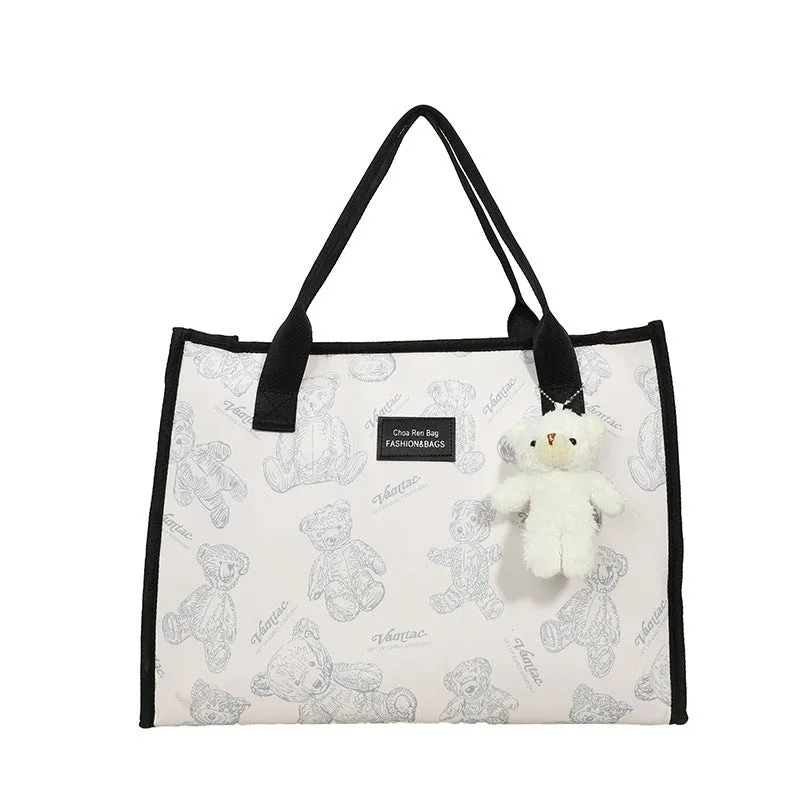 Women's black canvas tote bag with rhombus pattern and sandwich pocket compartments