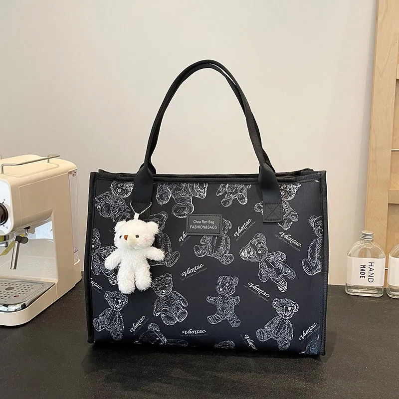 Women's black canvas tote bag with rhombus pattern and sandwich pocket compartments