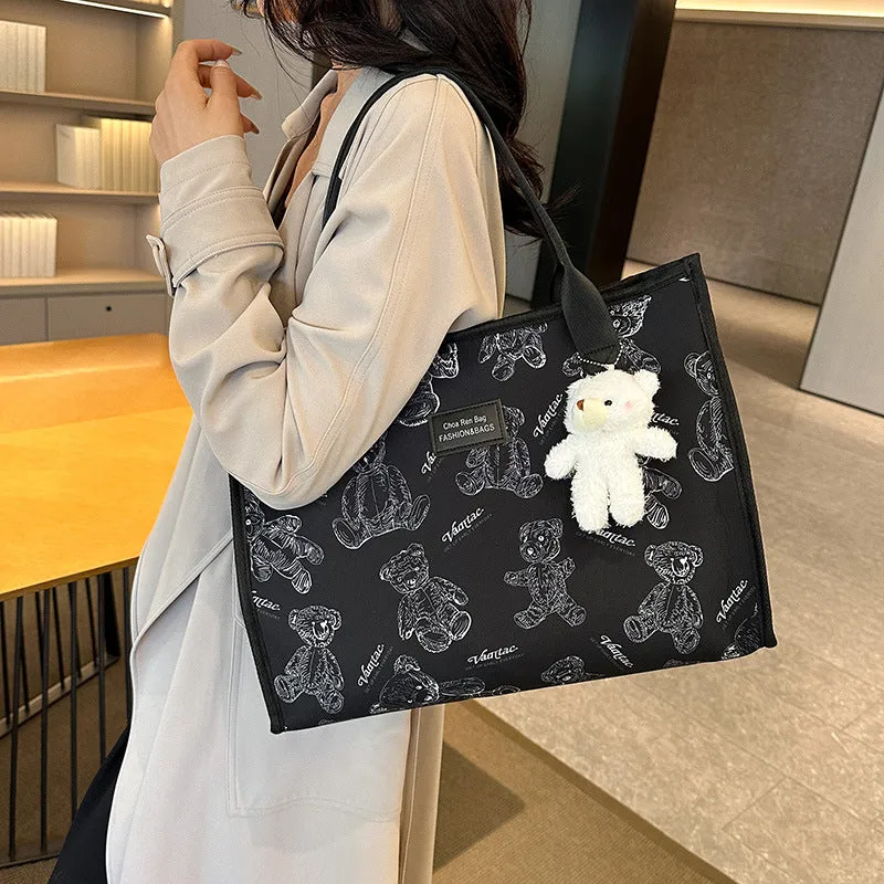 Women's black canvas tote bag with rhombus pattern and sandwich pocket compartments