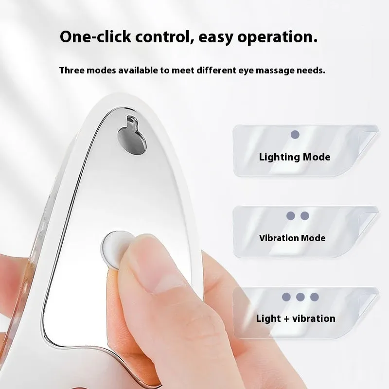 White portable rechargeable red light eye massager on a table