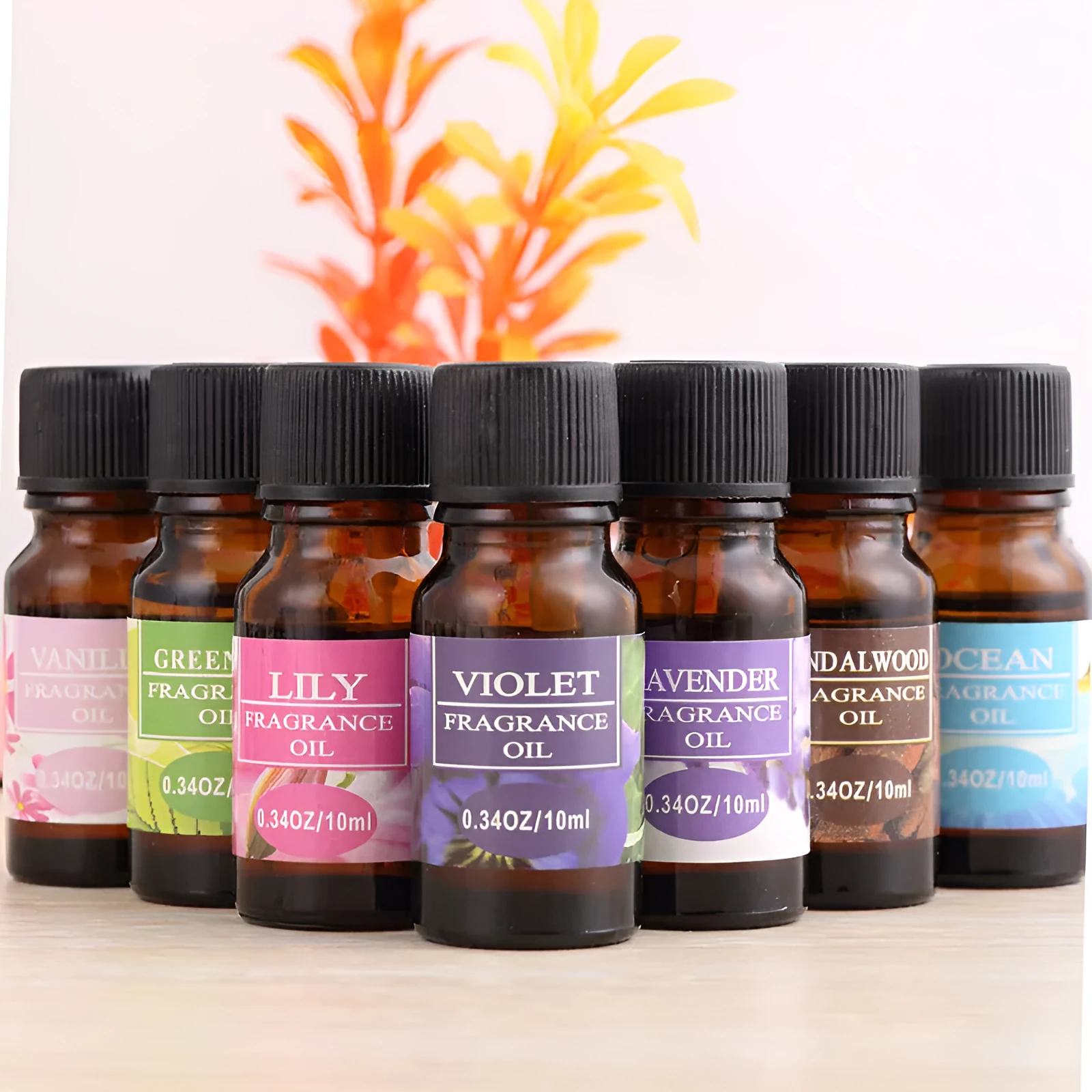 Set of 12 small glass bottles of aromatherapy essential oil, 10ml each, with labels showing Lavender, Rose, Lemon, and other fragrances.