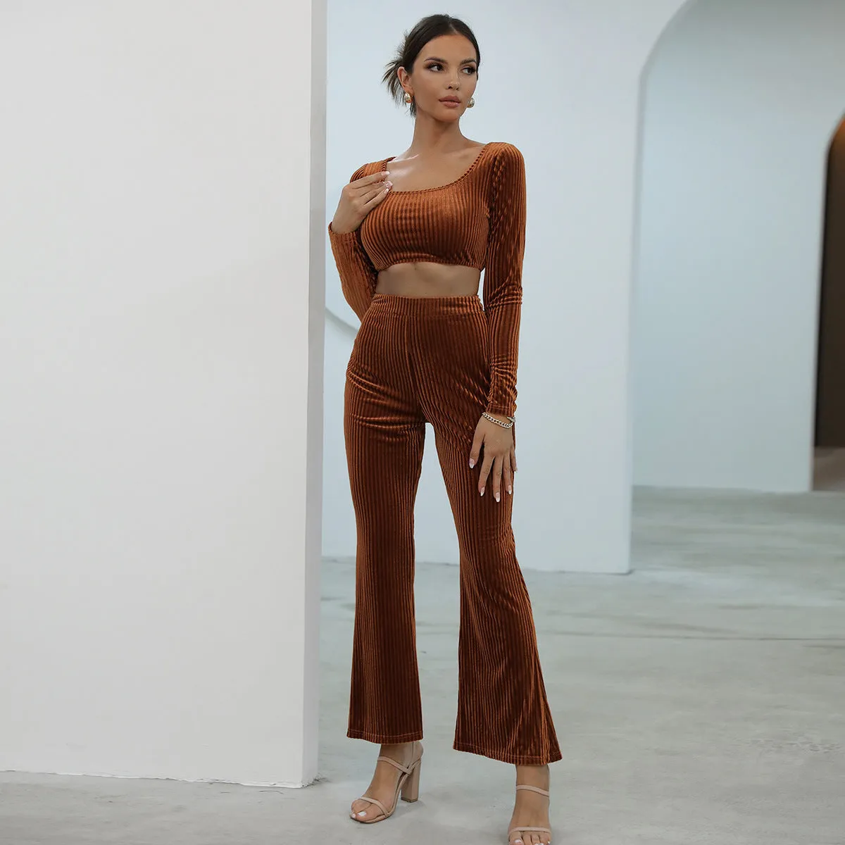 Caramel coloured long sleeve sweater and trousers casual set on a hanger