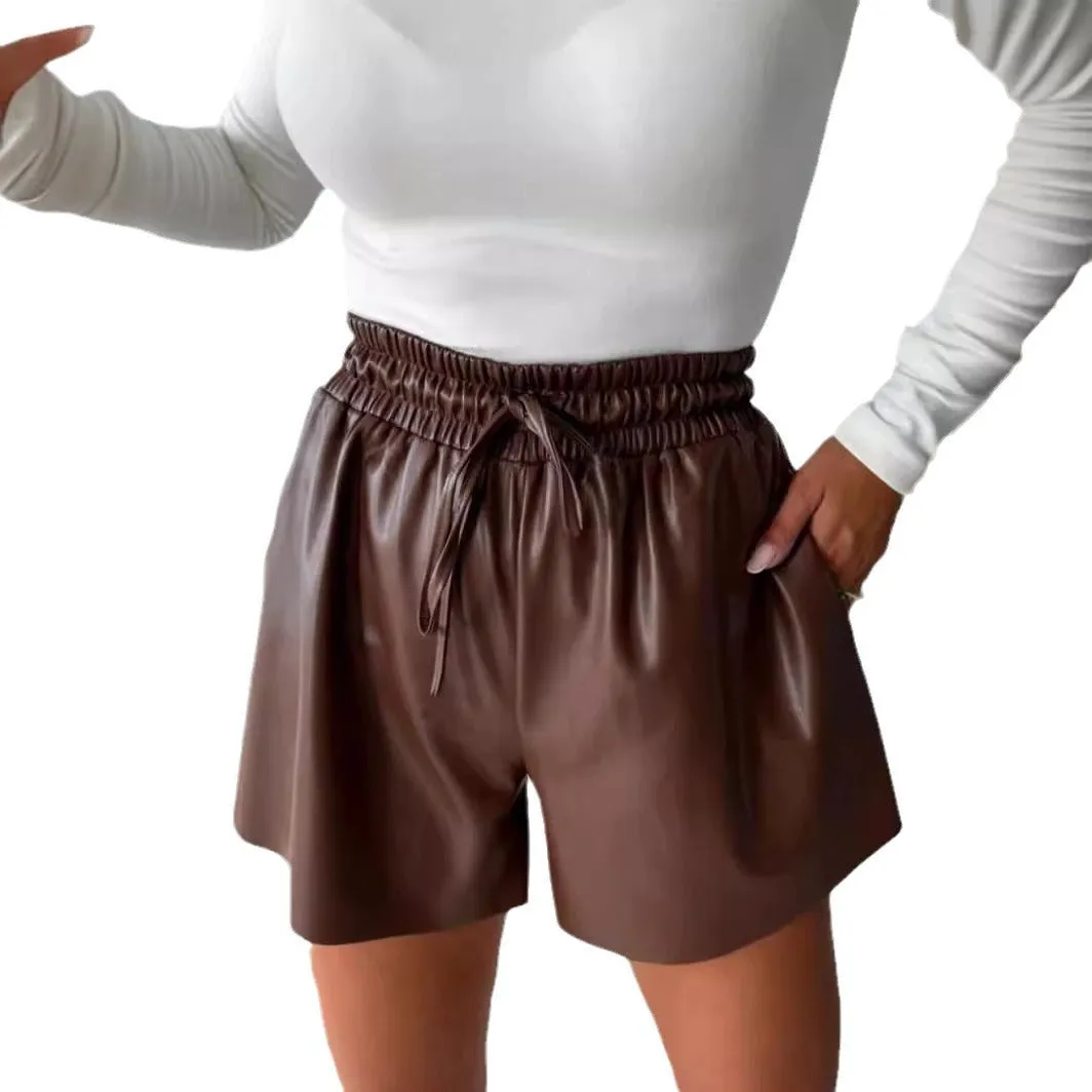 Women's black drawstring lace-up wide-leg casual shorts made of PU leather-look fabric.