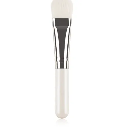 Wooden handle portable facial treatment brush with artificial fibre bristles on white background