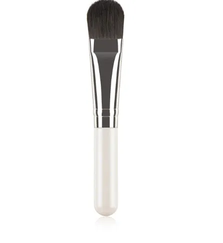 Wooden handle portable facial treatment brush with artificial fibre bristles on white background