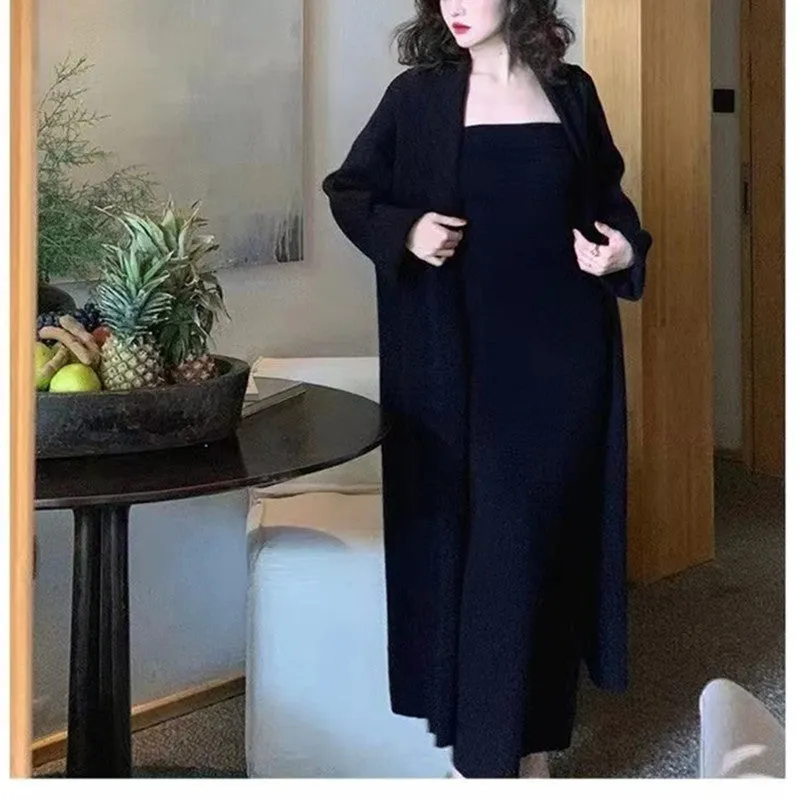 Women's grey knitted long-sleeve dress and matching cardigan set laid flat.