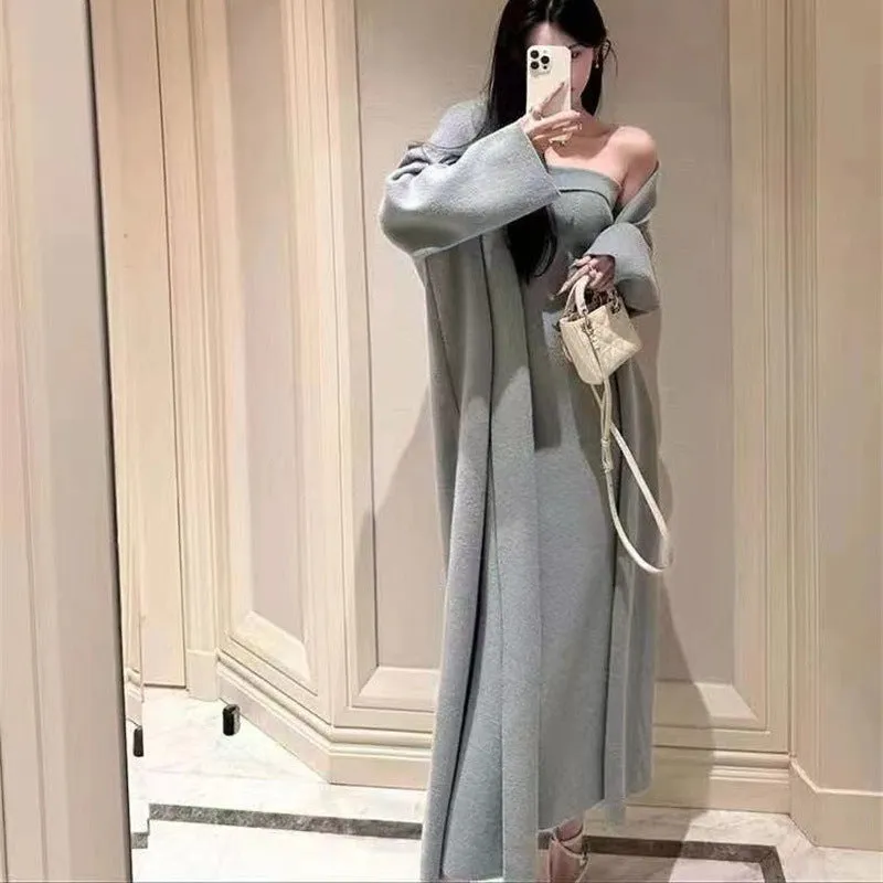 Women's grey knitted long-sleeve dress and matching cardigan set laid flat.