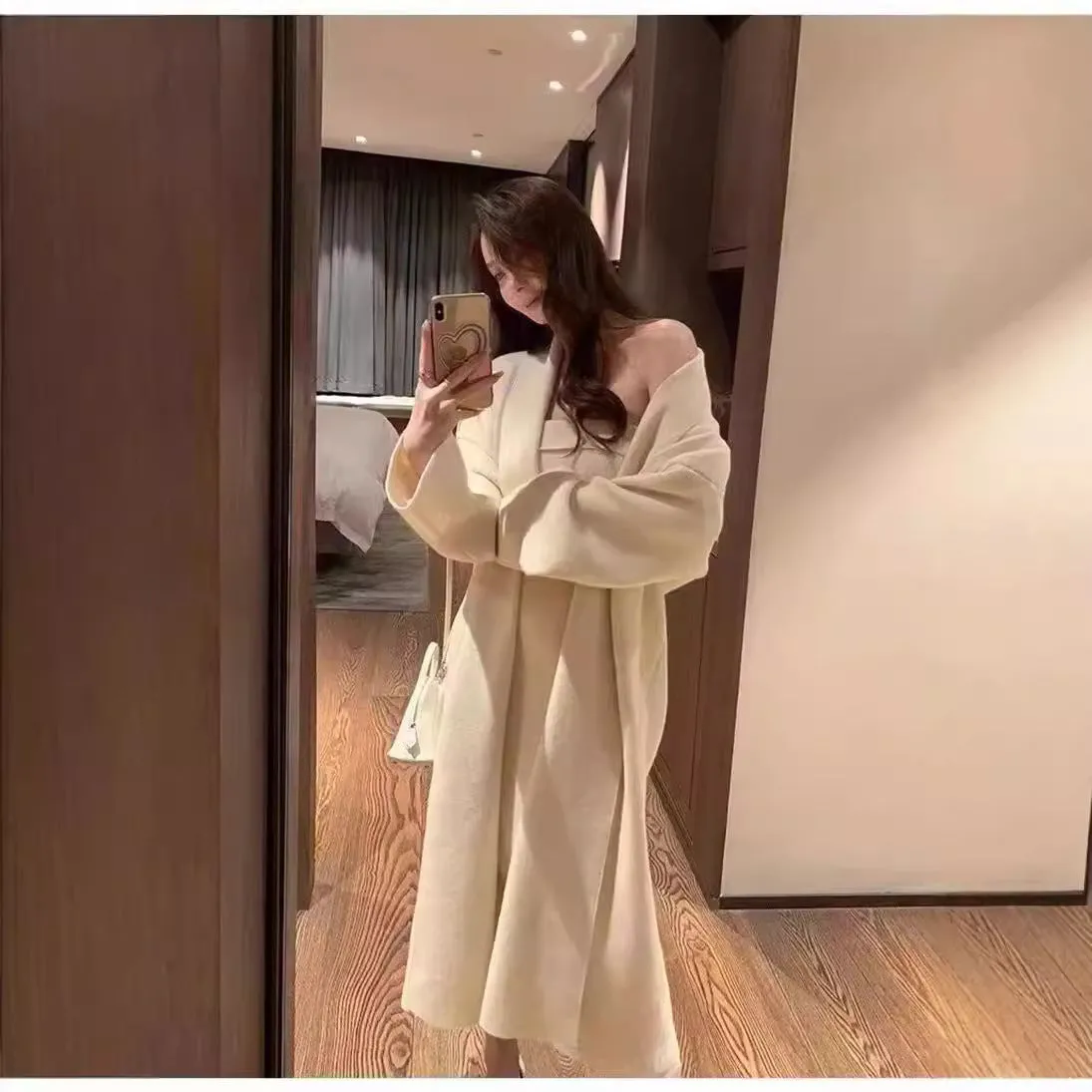 Women's grey knitted long-sleeve dress and matching cardigan set laid flat.