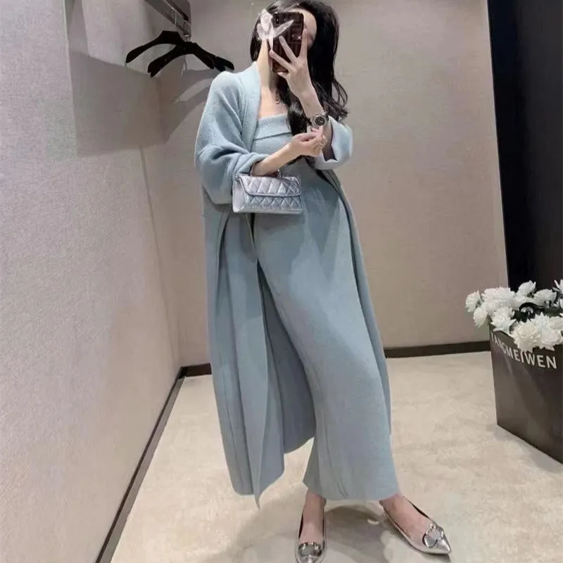 Women's grey knitted long-sleeve dress and matching cardigan set laid flat.