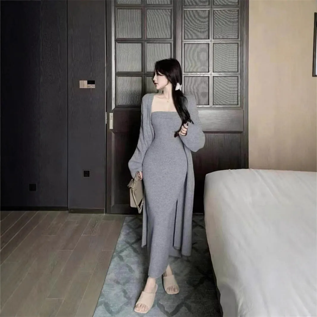 Women's grey knitted long-sleeve dress and matching cardigan set laid flat.