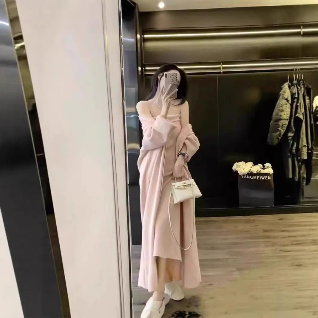 Women's grey knitted long-sleeve dress and matching cardigan set laid flat.