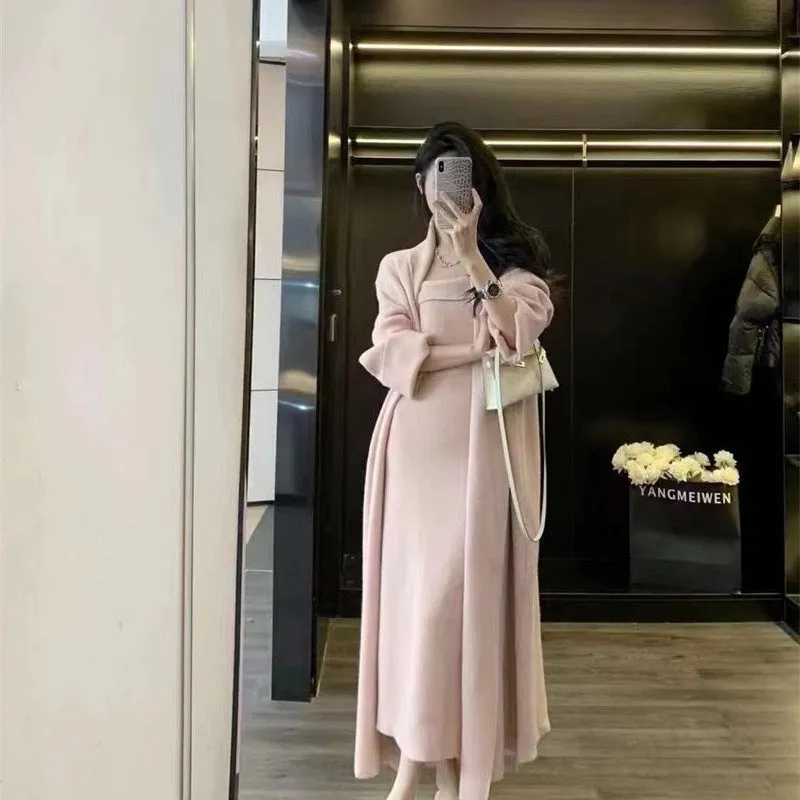 Women's grey knitted long-sleeve dress and matching cardigan set laid flat.
