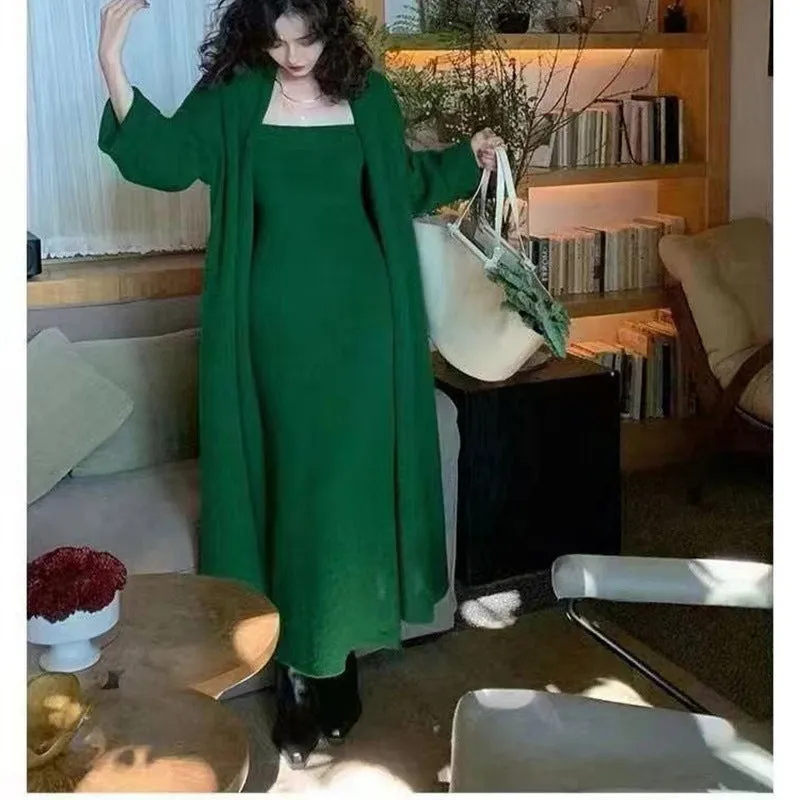 Women's grey knitted long-sleeve dress and matching cardigan set laid flat.