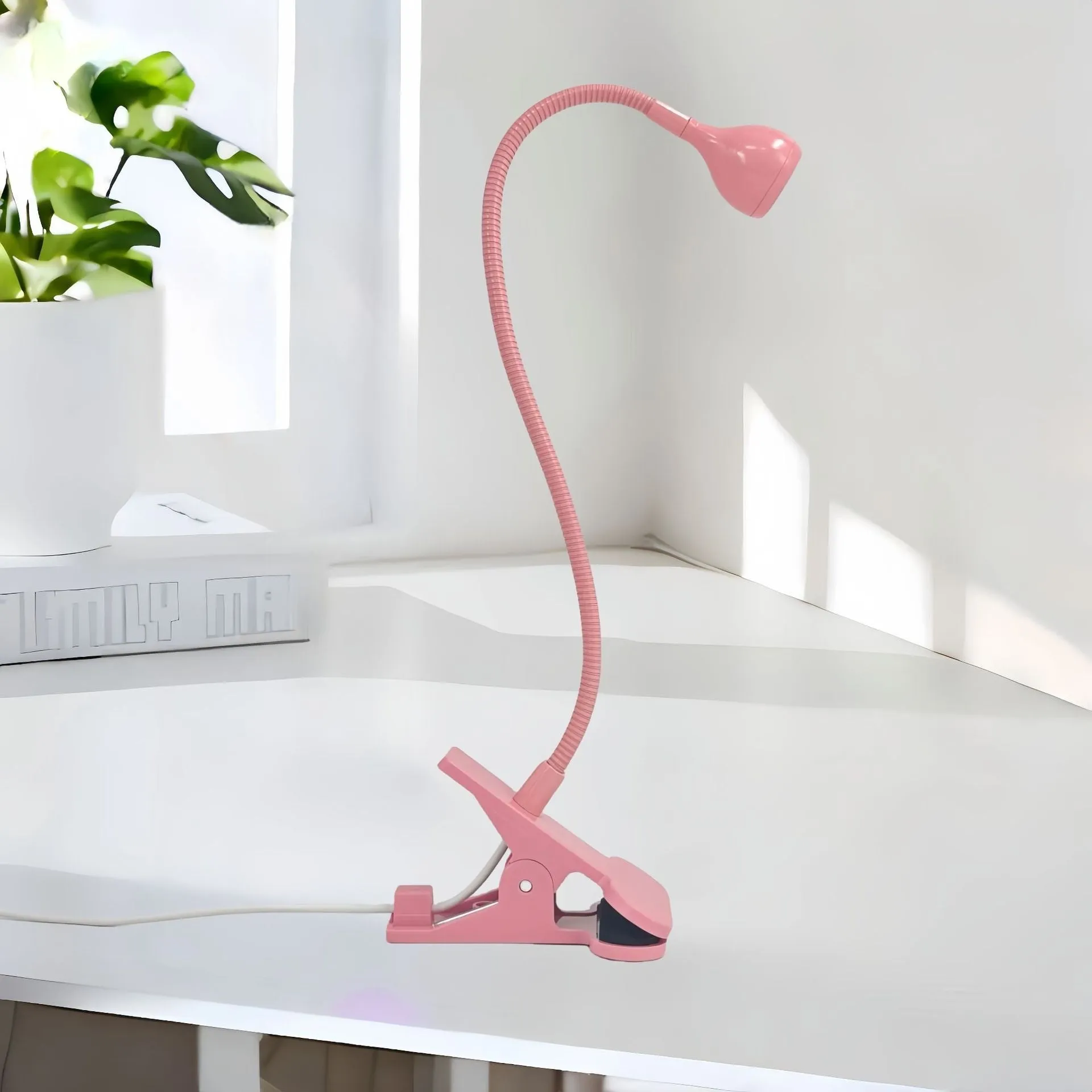 Goose neck nail lamp with USB clip, 395nm purple light curing UV glue on nails in a home manicure setting.