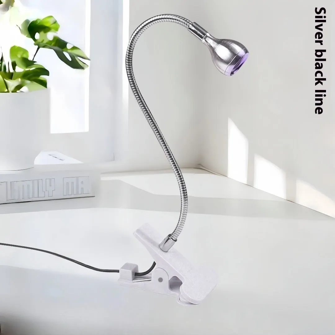 Goose neck nail lamp with USB clip, 395nm purple light curing UV glue on nails in a home manicure setting.