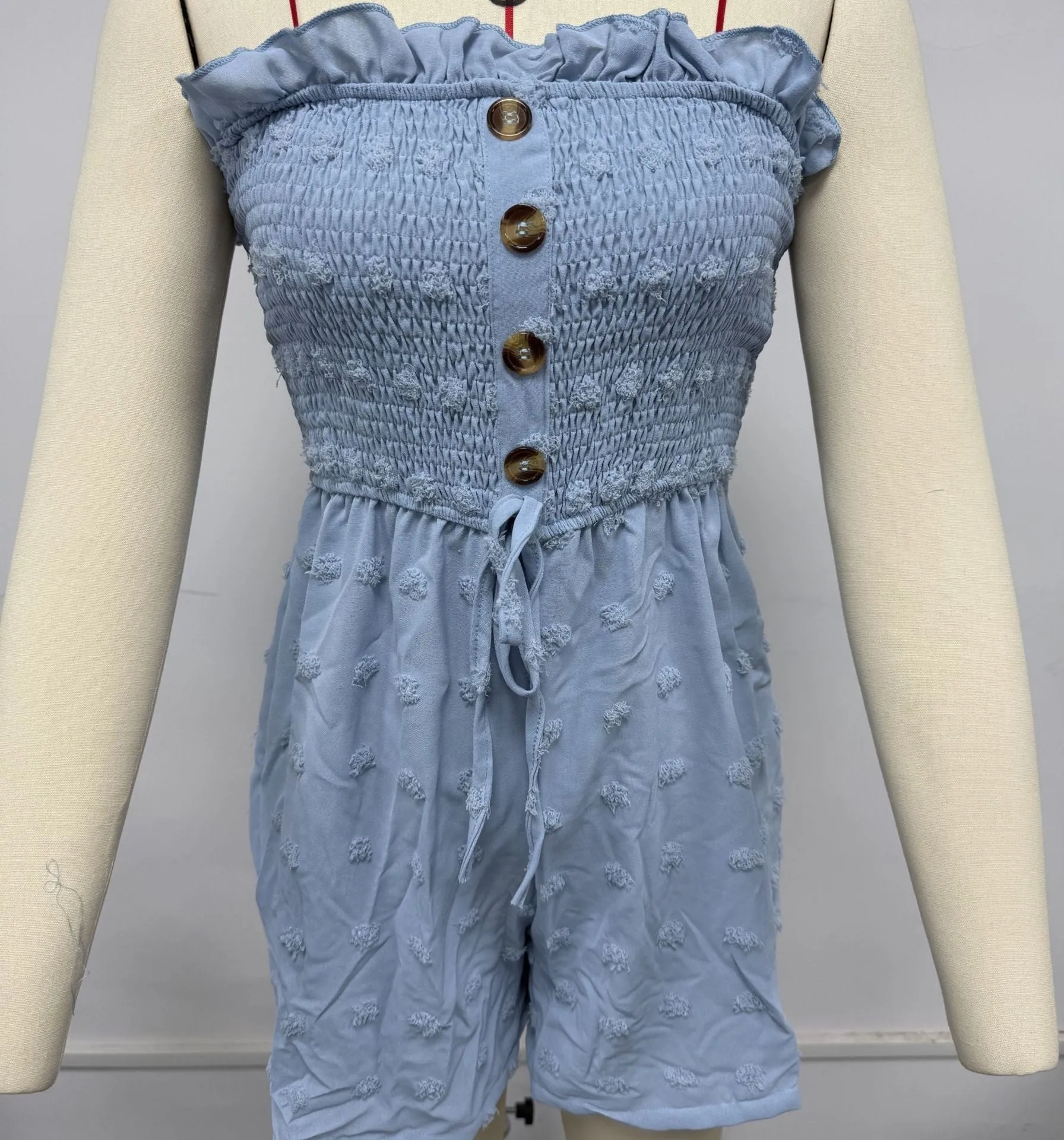 Women's off-shoulder sleeveless jumpsuit in blue polyester with button detail and mid-waist ankle-length design