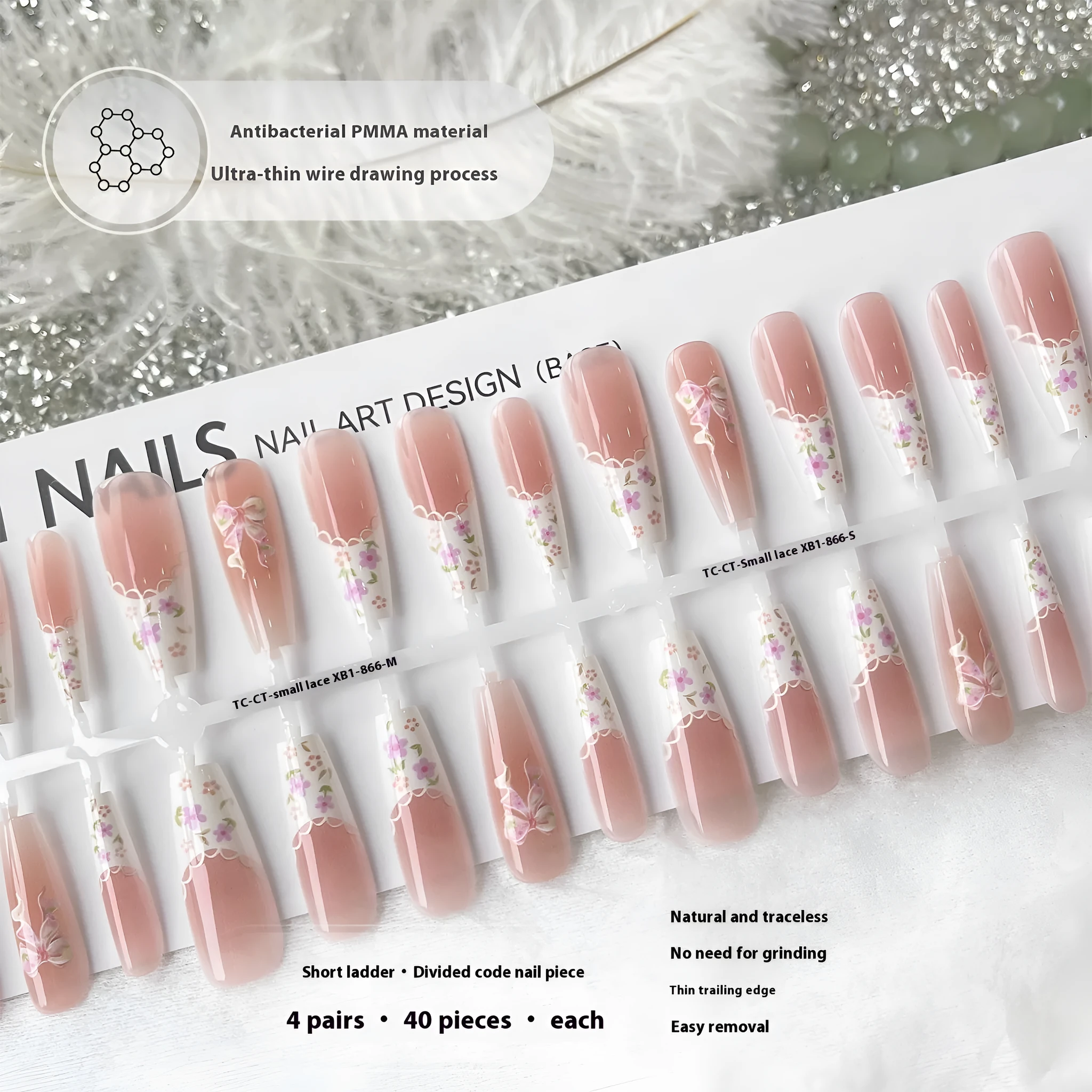 Set of 40 small floral prefabricated nail tips with long ladder velvet seal layer in white, displayed on a flat surface