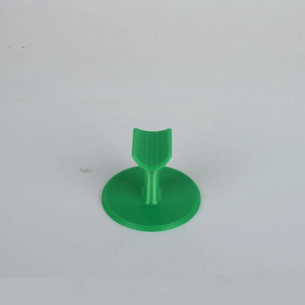 Chinese style resin nail bracket 6x6x4.3 cm on a desk holding nails