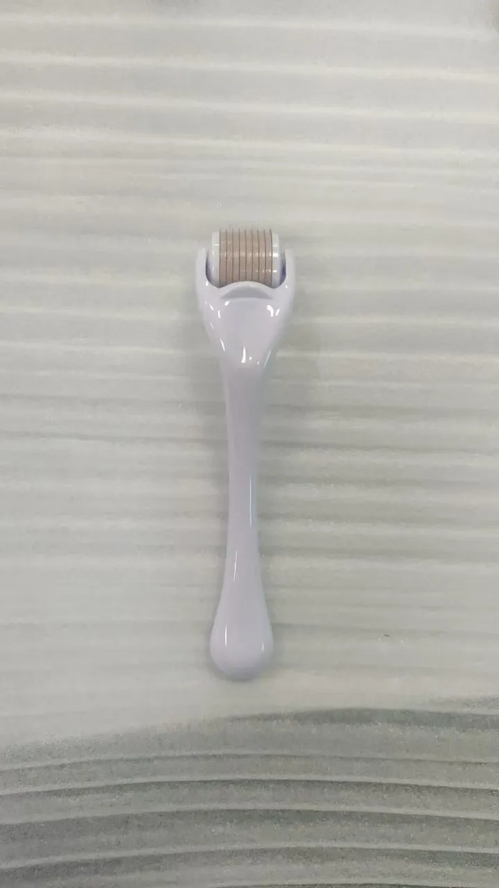 Micro needle derma roller with 540 needles in PC material showing handle and wheel colour options