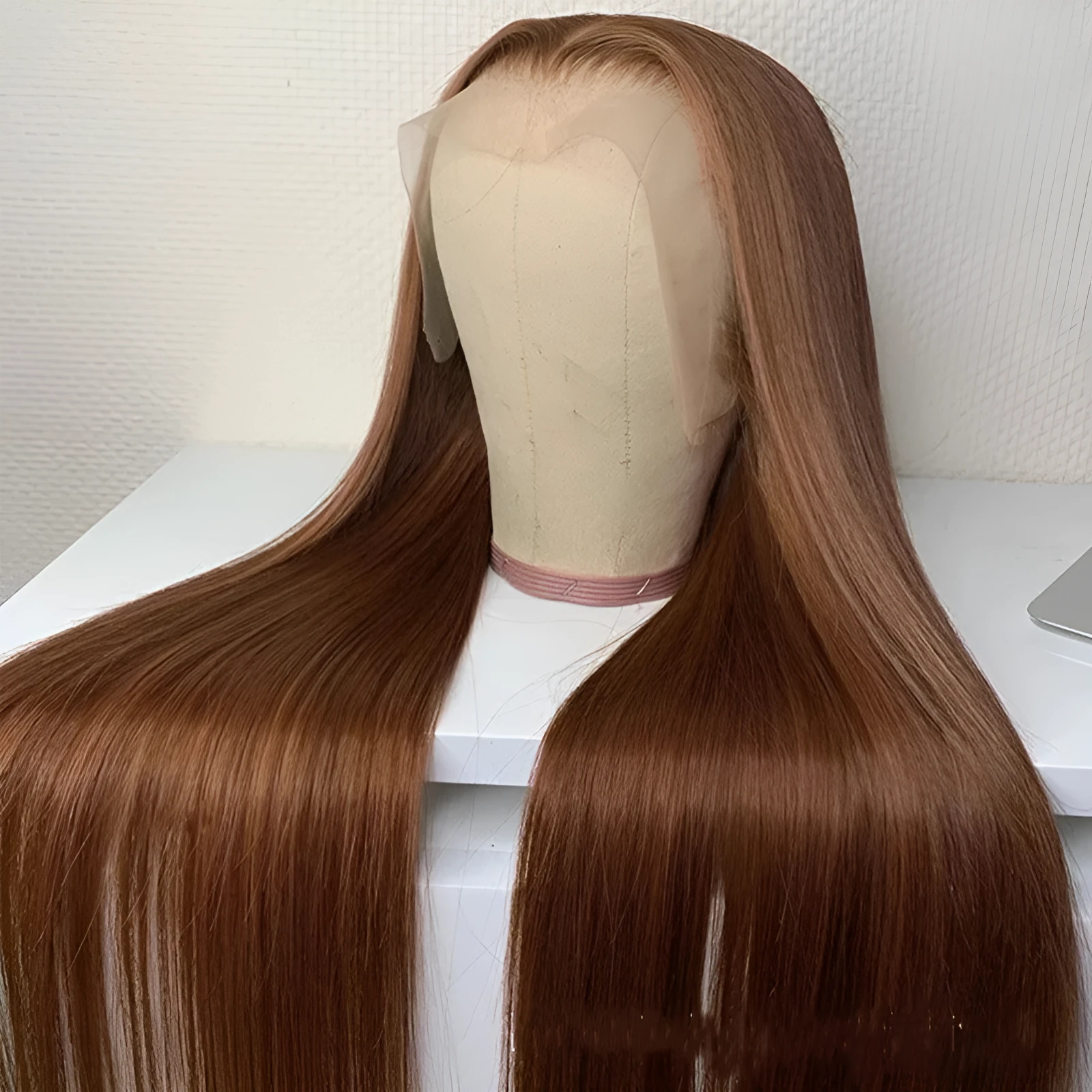 Brown human hair wig with 13x6 lace front and 150% density on a mannequin head
