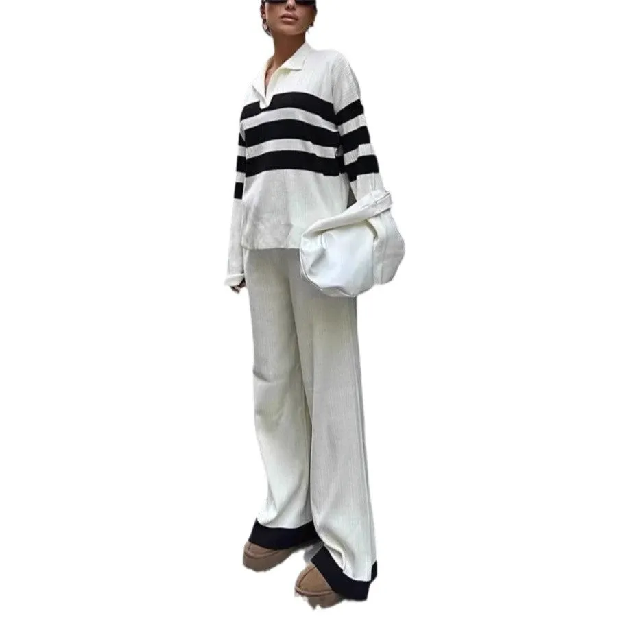 Women's black and white striped knitted polo collar two-piece set with long sleeves and trousers.