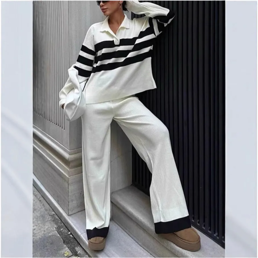 Women's black and white striped knitted polo collar two-piece set with long sleeves and trousers.