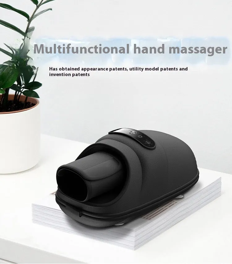 Intelligent electric hand massager with hot compress in black colour, multi-point massage pads, and USB charging cable on a desk