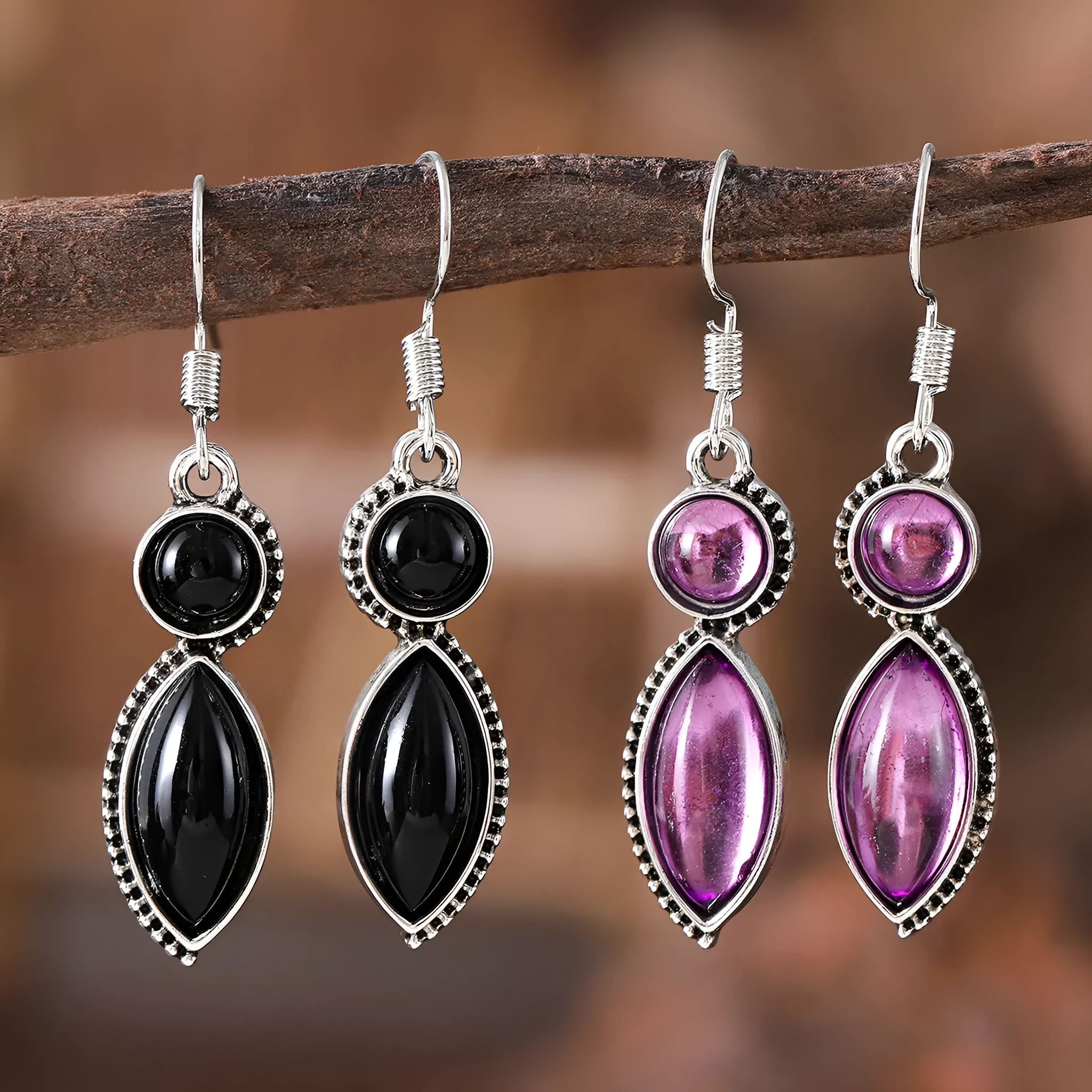 A pair of vintage geometric pendant earrings in black and purple with a round detail, made from zinc alloy.